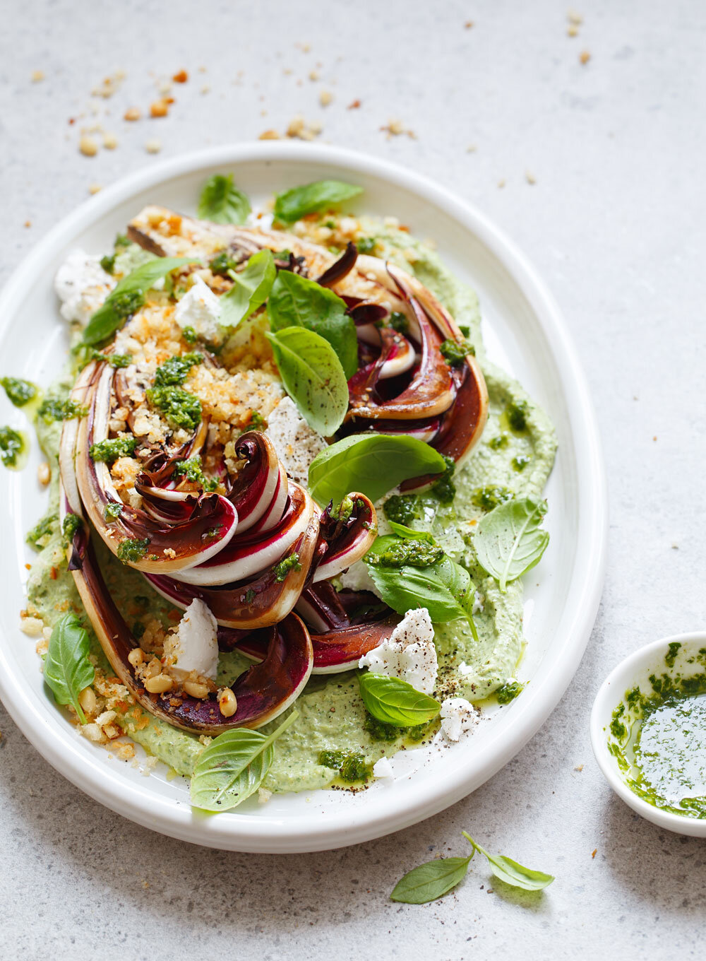 Grilled radicchio salad with creamy pesto, basil, goat cheese, and toasted pine nuts, served by Joel Catering, New Orleans' leading catering service