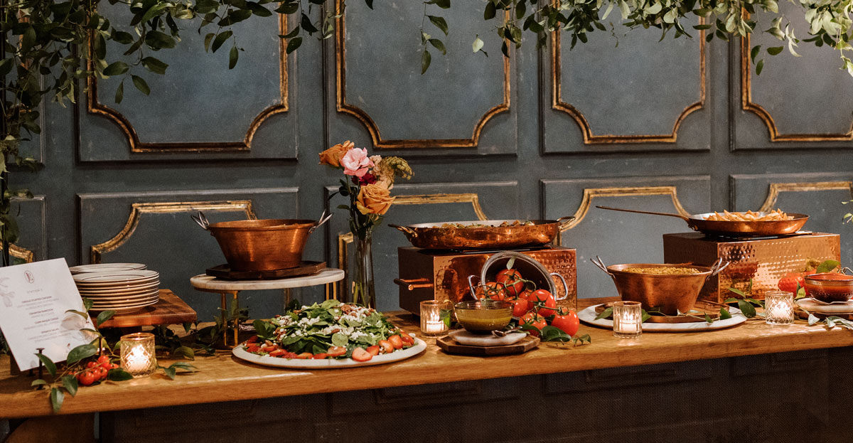 Catering station set up at a wedding reception with New Orleans style cuisine